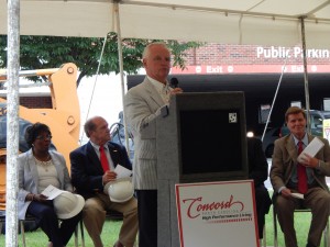 Mayor Padgett makes remarks at the Concord City Hall Groundbreaking Ceremony. Seated to the right is City Manager Brian Hiatt.
